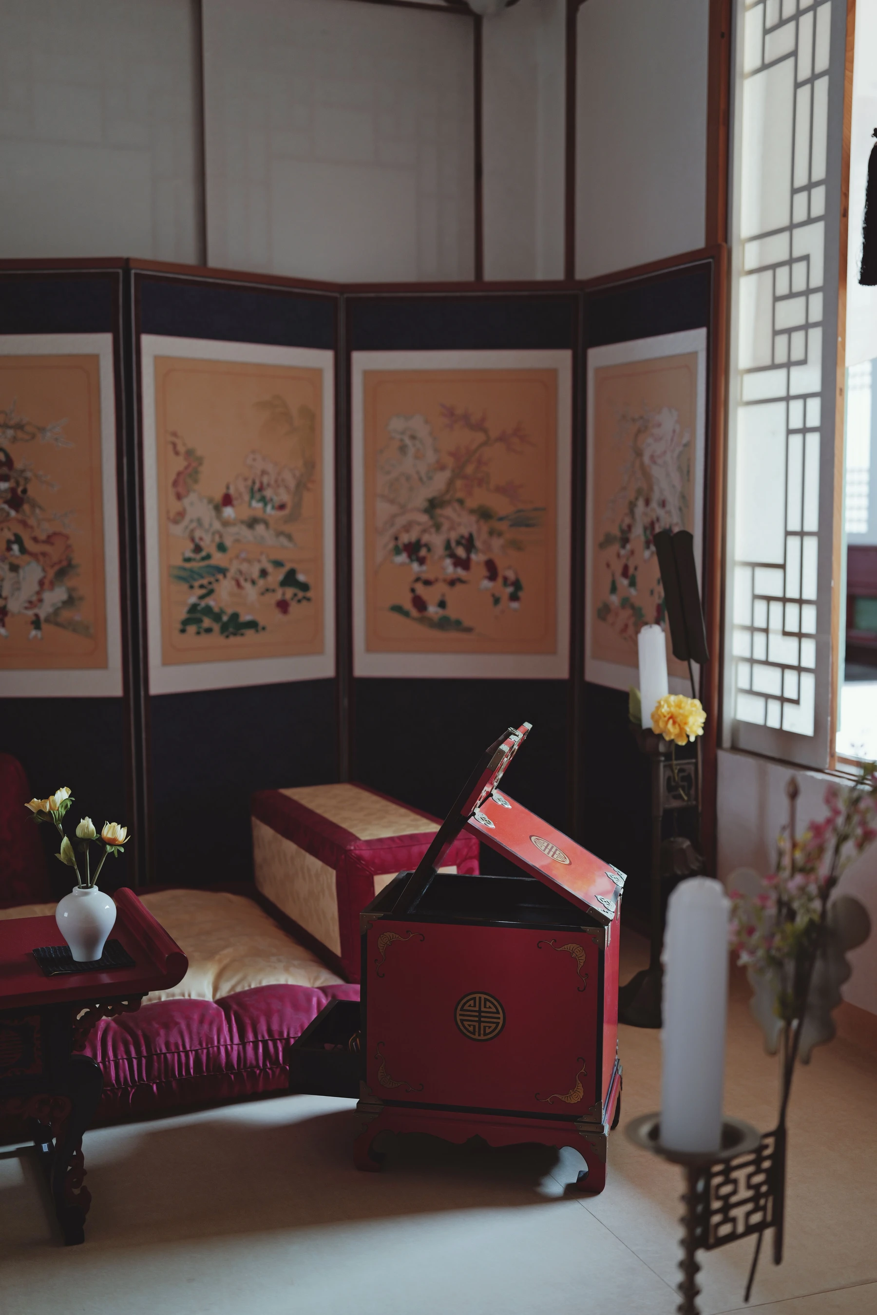Painted folding screens and woodwork in a traditional Korean interior