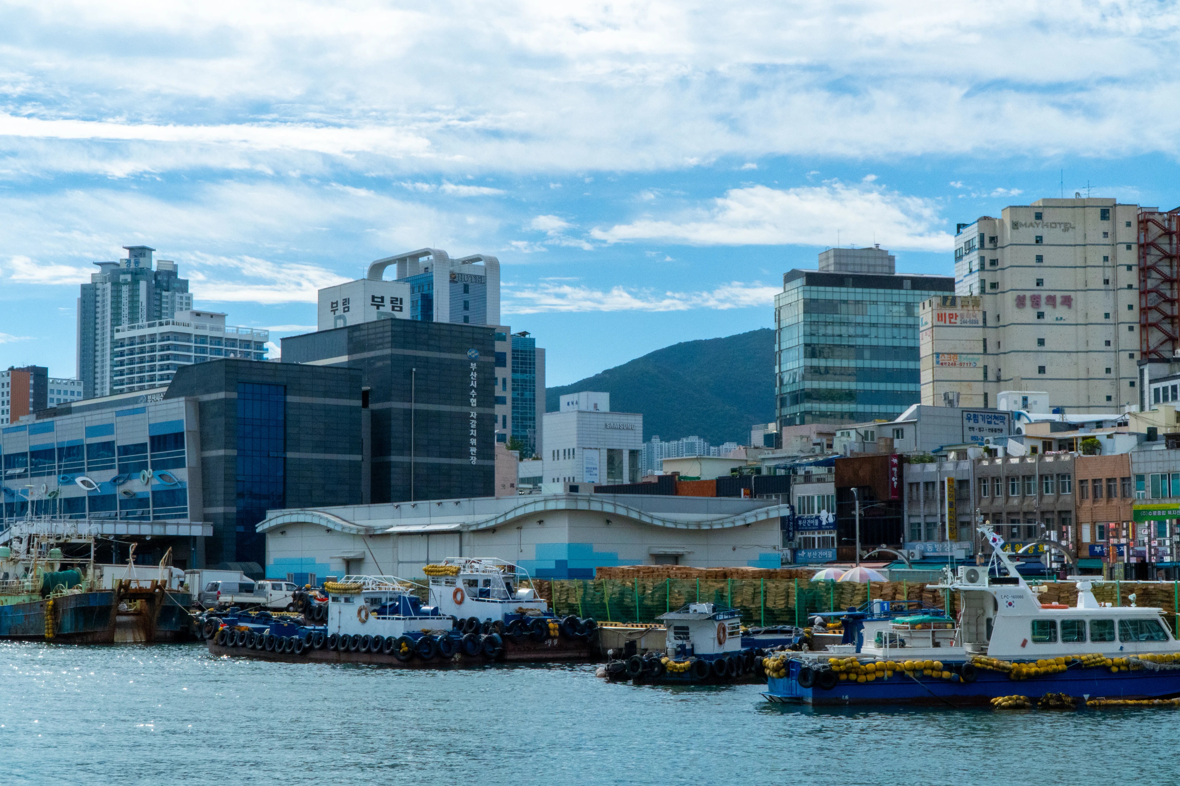 Fishing boats and the working harbor in Busan